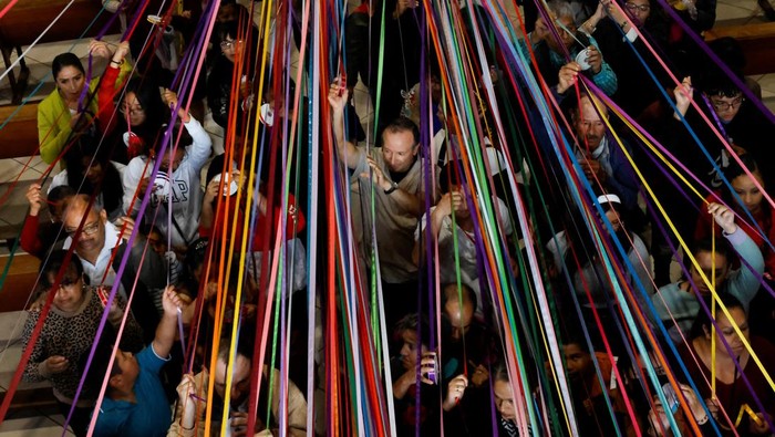 Catholics carry a statue of Jesus Nazareno during a procession known as 