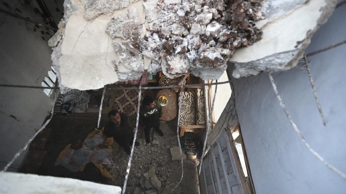 Lebanese check a small bridge and a power transformer that were destroyed by an Israeli airstrike, in Maaliya village, south Lebanon, Friday, April 7, 2023. Israel launched rare strikes in southern Lebanon early Friday and pressed on with bombing targets in the Gaza Strip, marking a widening escalation in the region following violence this week at Jerusalem's most sensitive holy site. (AP Photo/Mohammed Zaatari)