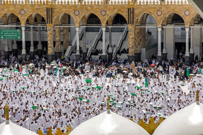 TOPSHOT - This picture taken on April 1, 2023 during the Muslim holy fasting month of Ramadan, from the Mecca Royal Clock Tower of the Abraj al-Bait skyscraper complex, shows an aerial view of Muslim worshippers around the Kaaba, the holiest shrine in the Grand Mosque complex in Saudi Arabia's holy city of Mecca. (Photo by Abdel Ghani BASHIR / AFP) (Photo by ABDEL GHANI BASHIR/AFP via Getty Images)