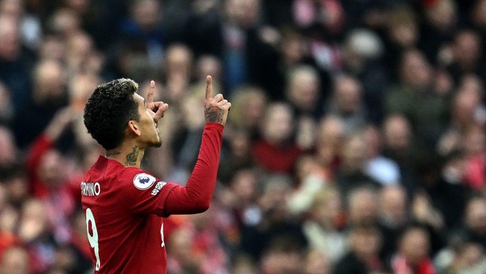 Liverpools Brazilian striker Roberto Firmino celebrates scoring the teams second goal during the English Premier League football match between Liverpool and Arsenal at Anfield in Liverpool, north west England on April 9, 2023. (Photo by Paul ELLIS / AFP) / RESTRICTED TO EDITORIAL USE. No use with unauthorized audio, video, data, fixture lists, club/league logos or live services. Online in-match use limited to 120 images. An additional 40 images may be used in extra time. No video emulation. Social media in-match use limited to 120 images. An additional 40 images may be used in extra time. No use in betting publications, games or single club/league/player publications. /  (Photo by PAUL ELLIS/AFP via Getty Images)