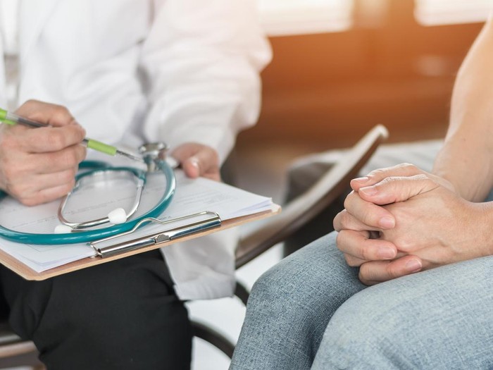 Doctor or psychiatrist consulting and diagnostic examining stressful woman patient on obstetric - gynecological female illness, or mental health in medical clinic or hospital healthcare service center