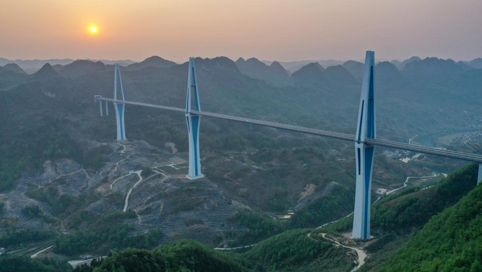 QIANNAN, CHINA - APRIL 11: Aerial view of Pingtang Bridge on April 11, 2023 in Qiannan Buyei and Miao Autonomous Prefecture, Guizhou Province of China. The cable-supported bridge has a span of 2,135 meters. (Photo by Qu Honglun/China News Service/VCG via Getty Images)