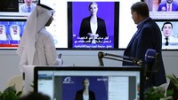 TOPSHOT - A journalist watches an introductory video by the artificial intelligence anchor Fedha on the twitter account of Kuwait News service, in Kuwait City on April 9, 2023. (Photo by YASSER AL-ZAYYAT / AFP) (Photo by YASSER AL-ZAYYAT/AFP via Getty Images)