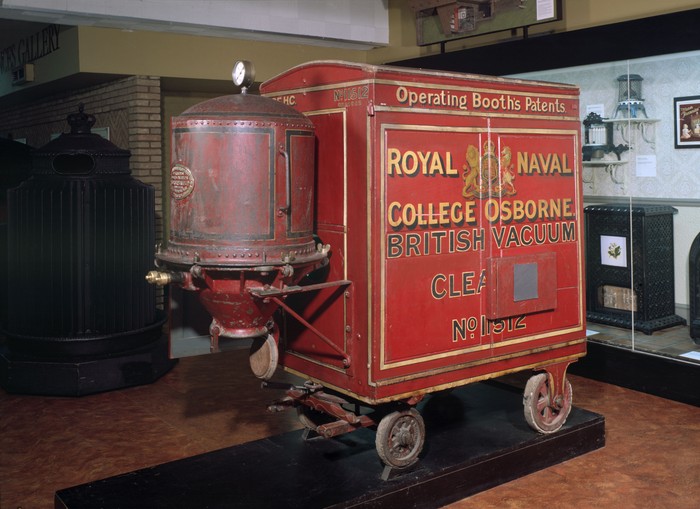 (Original Caption) Beginning of the vacuum cleaner. Movable gadget as wheeled up to house for a cleaning job, ca. 1900, photograph. BPA 2 #5184