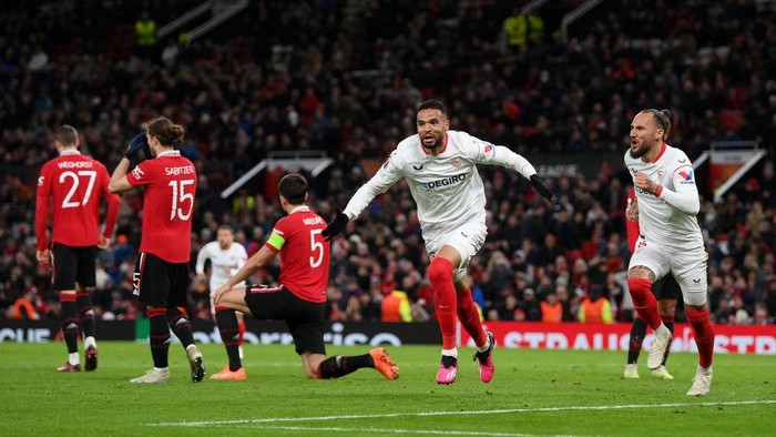 MANCHESTER, ENGLAND - APRIL 13: Yousseff En-Nesyri of Sevilla FC celebrates after Harry Maguire of Manchester United scores an own goal, Sevilla FCs second goal during the UEFA Europa League quarterfinal first leg match between Manchester United and Sevilla FC at Old Trafford on April 13, 2023 in Manchester, England. (Photo by Shaun Botterill/Getty Images)
