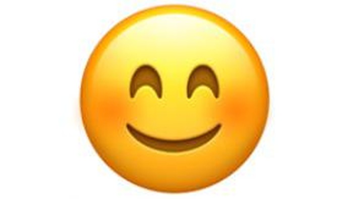 Emoji tersenyum dan mata ikut tersenyum.