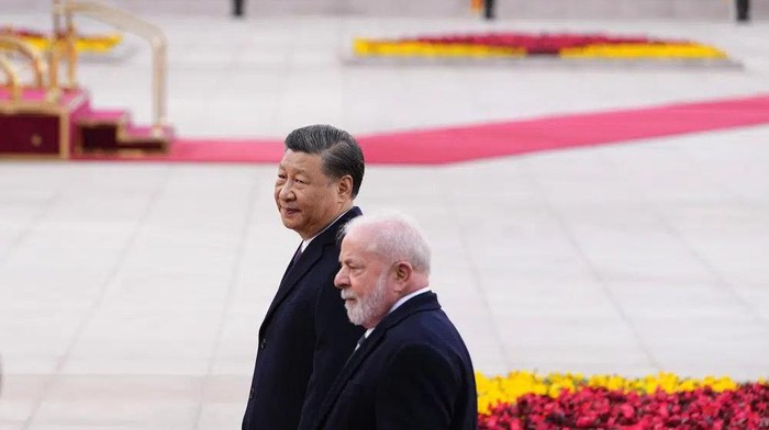 Brazilian President Luiz Inacio Lula da Silva, right, and Chinese President Xi Jinping walk during a welcome ceremony outside the Great Hall of the People in Beijing Friday, April 14, 2023. (Ken Ishii/Pool Photo via AP)