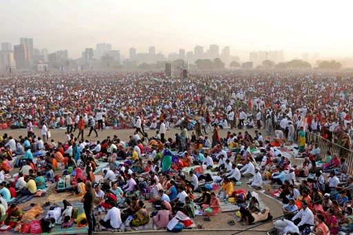In this photograph taken on April 16, 2023, people gather to attend an award ceremony on the outskirts of Mumbai. - Heatstroke killed 11 people in India after an estimated million spectators waited for hours in the sun at a government-sponsored awards ceremony, officials said as early summer temperatures soared. (Photo by AFP)