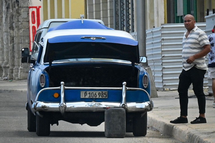 People wait for fuel at a gas station in Havana on April 14, 2023. - Cuba is experiencing a new gasoline shortage crisis because the countries that provide it with crude also face a complex energy situation and have not fulfilled their commitments, the government reported on Friday. (Photo by ADALBERTO ROQUE / AFP) (Photo by ADALBERTO ROQUE/AFP via Getty Images)