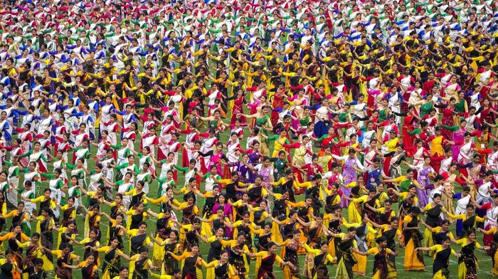 Assamese dancers in traditional attire perform as they attempt Guinness World Record in the largest folk dance performance category in Guwahati, India, Thursday, April 13, 2023.  (AP Photo/Anupam Nath)