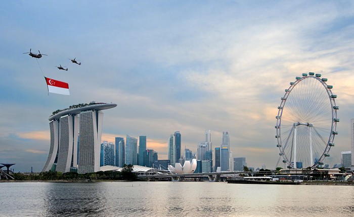 [UNVERIFIED CONTENT] Singapore celebrates its 48th National Day with a flag-bearing Chinook helicopter, escorted by two Apache attack helicopters, flying over Marina Bay.  In the background are Marina Bay Sands on the left and The Singapore Flyer on the right.  This is the full-dress rehearsal for the actual day on 9th Aug.