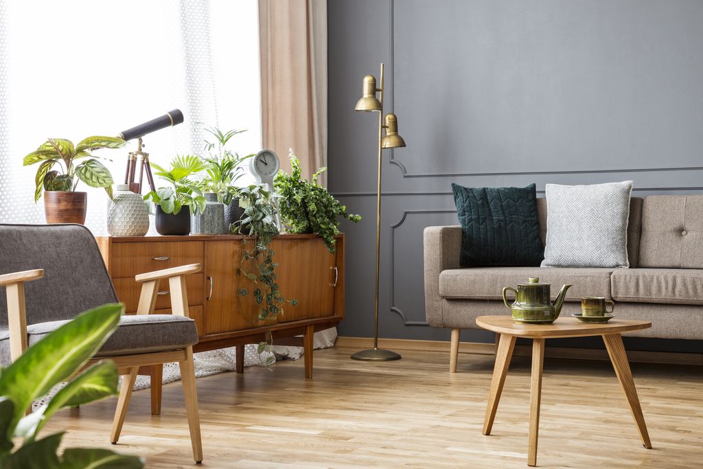 Dekorasi Rumah Lebaran 2023 White candle in a golden framed glass as centrepiece of a table decor