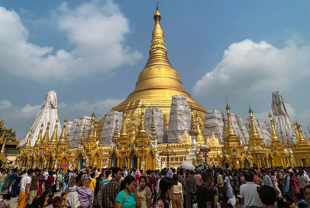 Buddhist devotees visit the Shwedagon pagoda following the Thingyan festival that marks the Burmese New Year in Yangon on April 17, 2023. (Photo by Sai Aung MAIN / AFP) (Photo by SAI AUNG MAIN/AFP via Getty Images)