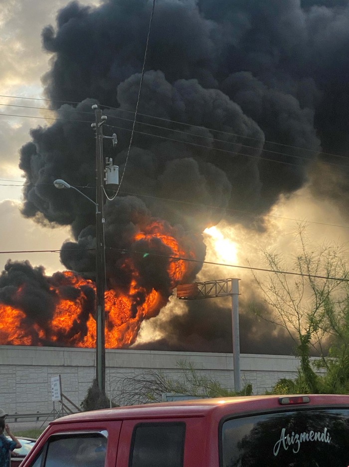 Flames and smoke rise from the site of an accident involving a fuel tank trailer in Brownsville, Texas, U.S., April 17, 2023 in this picture obtained from social media.  Victor Ponce/via REUTERS  THIS IMAGE HAS BEEN SUPPLIED BY A THIRD PARTY. MANDATORY CREDIT. NO RESALES. NO ARCHIVES.