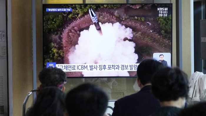 A TV screen shows an image of North Korean leader Kim Jong Un, right, and his daughter during a news program at the Seoul Railway Station in Seoul, South Korea, Wednesday, April 19, 2023. Kim said his country has completed the development of its first military spy satellite and ordered officials to go ahead with its launch as planned, state media reported Wednesday. (AP Photo/Ahn Young-joon)
