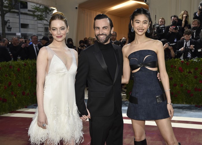 Emma Stone, from left, Nicolas Ghesquiere and HoYeon Jung attend The Metropolitan Museum of Arts Costume Institute benefit gala celebrating the opening of the 