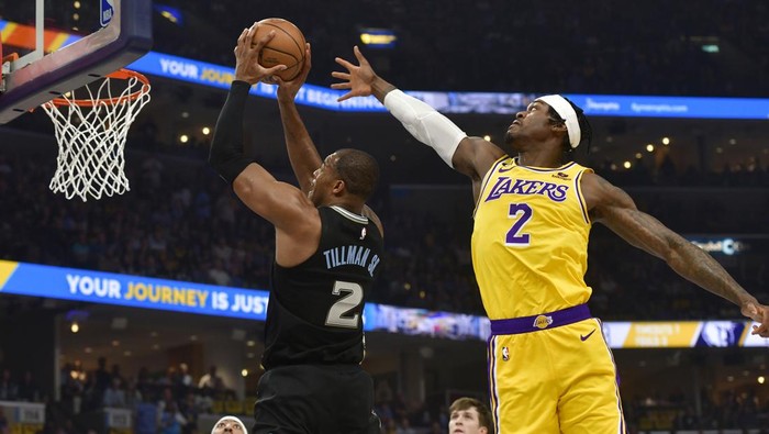 Memphis Grizzlies forward Xavier Tillman shoots next to Los Angeles Lakers forward Jarred Vanderbilt during the first half of Game 2 of a first-round NBA basketball playoff series Wednesday, April 19, 2023, in Memphis, Tenn. (AP Photo/Brandon Dill)