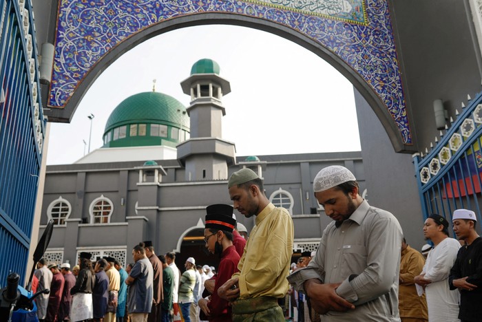 Muslims perform a mass prayer at a mosque during Eid al-Fitr, marking the end of the holy fasting month of Ramadan, in Kuala Lumpur, Malaysia, April 22, 2023. REUTERS/Hasnoor Hussain