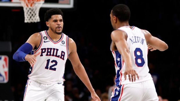 NEW YORK, NEW YORK - APRIL 22: Tobias Harris #12 reacts with De'Anthony Melton #8 of the Philadelphia 76ers against the Brooklyn Nets during the second half of Game Four of the Eastern Conference First Round Playoffs at Barclays Center on April 22, 2023 in the Brooklyn borough of New York City. The 76ers won 96-88. NOTE TO USER: User expressly acknowledges and agrees that, by downloading and or using this photograph, User is consenting to the terms and conditions of the Getty Images License Agreement. (Photo by Sarah Stier/Getty Images)
