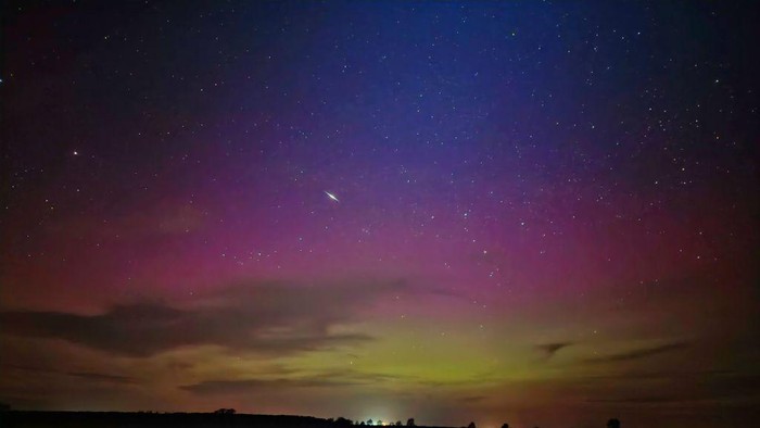 dpatop - 24 April 2023, Saxony-Anhalt, Fischbeck: A celestial body passes through the auroras in the night sky. The more north on the globe the observer stood, the more visible the lights became. Photo: Cevin Dettlaff/dpa (Photo by Cevin Dettlaff/picture alliance via Getty Images)