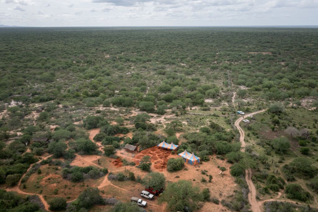An aerial view shows the mass-grave site in Shakahola, outside the coastal town of Malindi, on April 25, 2023. - Kenyan investigators unearthed another 16 bodies on Tuesday in a forest where a cult was believed to be practising mass starvation, bringing the number of victims so far to 89 including children. There are fears more corpses could be found in Shakahola forest where cult leader Paul Mackenzie Nthenge had allegedly been telling his followers that starvation was the only path to God. (Photo by Yasuyoshi CHIBA / AFP) (Photo by YASUYOSHI CHIBA/AFP via Getty Images)