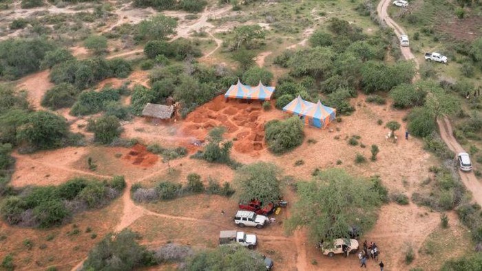 An aerial view shows the mass-grave site in Shakahola, outside the coastal town of Malindi, on April 25, 2023. - Kenyan investigators unearthed another 16 bodies on Tuesday in a forest where a cult was believed to be practising mass starvation, bringing the number of victims so far to 89 including children. There are fears more corpses could be found in Shakahola forest where cult leader Paul Mackenzie Nthenge had allegedly been telling his followers that starvation was the only path to God. (Photo by Yasuyoshi CHIBA / AFP) (Photo by YASUYOSHI CHIBA/AFP via Getty Images)