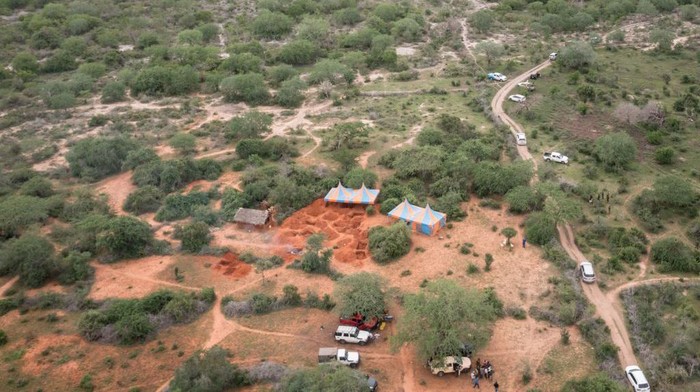 1252170498 An aerial view shows the mass-grave site in Shakahola, outside the coastal town of Malindi, on April 25, 2023. - Kenyan investigators unearthed another 16 bodies on Tuesday in a forest where a cult was believed to be practising mass starvation, bringing the number of victims so far to 89 including children. There are fears more corpses could be found in Shakahola forest where cult leader Paul Mackenzie Nthenge had allegedly been telling his followers that starvation was the only path to God. (Photo by Yasuyoshi CHIBA / AFP) (Photo by YASUYOSHI CHIBA/AFP via Getty Images)