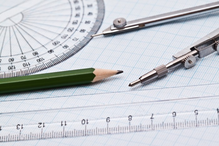 set of geometric objects closeup on graph paper