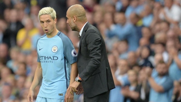 Manchester Citys Spanish manager Pep Guardiola talks to Manchester Citys French midfielder Samir Nasri (L) as he prepares to come on during the English Premier League football match between Manchester City and West Ham United at the Etihad Stadium in Manchester, north west England, on August 28, 2016. / AFP / Oli SCARFF / RESTRICTED TO EDITORIAL USE. No use with unauthorized audio, video, data, fixture lists, club/league logos or live services. Online in-match use limited to 75 images, no video emulation. No use in betting, games or single club/league/player publications.  /         (Photo credit should read OLI SCARFF/AFP via Getty Images)