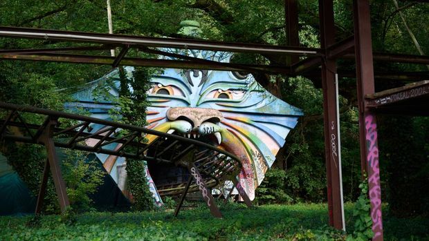 Swings and a ferris wheel remain in an abandoned amusement park of Pripyat, Ukraine. The park was scheduled to open on May 1, 1986, for the Soviet May Day celebrations. It never opened, as the Chernobyl disaster happened on April 26, 1986, a week before the opening. (Claudia Himmelreich/McClatchy DC/Tribune News Service via Getty Images)