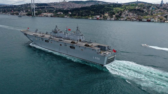 ISTANBUL, TURKIYE - APRIL 23: The TCG Anadolu, Turkiye's largest warship and the world's first unmanned combat aerial vehicle (UCAV) carrier, passes through the Bosphorus as it was accompanied by ATAK helicopters and fighter jets in Istanbul, Turkiye on April 23, 2023. (Photo by Cem Tekkesinoglu/Anadolu Agency via Getty Images)