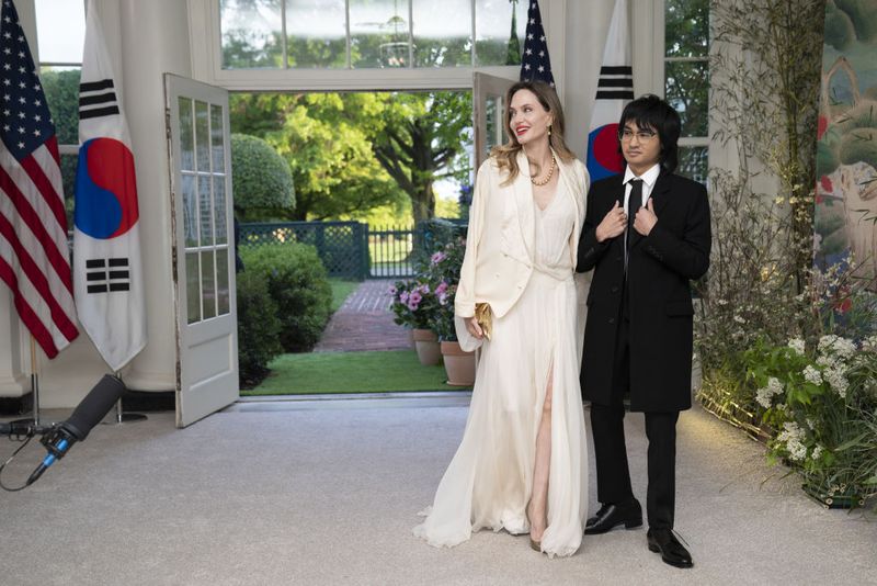 Actress Angelina Jolie, left, and Maddox Jolie-Pitt arrive to attend a state dinner in honor of South Korean President Yoon Suk Yeol and South Korean First Lady Kim Keon Hee hosted by US President Joe Biden and First Lady Jill Biden at the White House in Washington, DC, US, on Wednesday, April 26, 2023. The US will strengthen the deterrence it provides South Korea against nuclear threats, securing a pledge from Seoul to honor commitments to not pursue its own atomic arsenal. Photographer: Sarah Silbiger/Bloomberg via Getty Images
