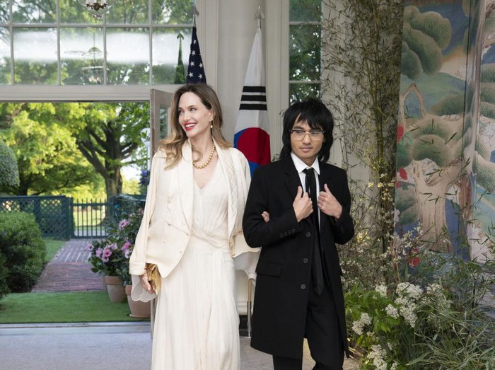Actress Angelina Jolie, left, and Maddox Jolie-Pitt arrive to attend a state dinner in honor of South Korean President Yoon Suk Yeol and South Korean First Lady Kim Keon Hee hosted by US President Joe Biden and First Lady Jill Biden at the White House in Washington, DC, US, on Wednesday, April 26, 2023. The US will strengthen the deterrence it provides South Korea against nuclear threats, securing a pledge from Seoul to honor commitments to not pursue its own atomic arsenal. Photographer: Sarah Silbiger/Bloomberg via Getty Images