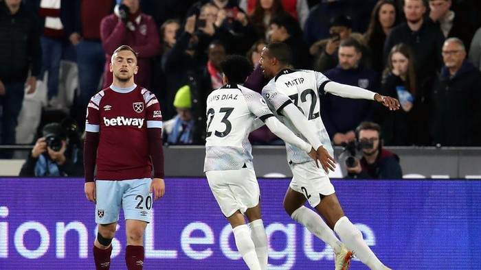 Liverpools Joel Matip (right) celebrates scoring their sides second goal of the game during the Premier League match at the London Stadium. Picture date: Wednesday April 26, 2023. (Photo by Simon Marper/PA Images via Getty Images)