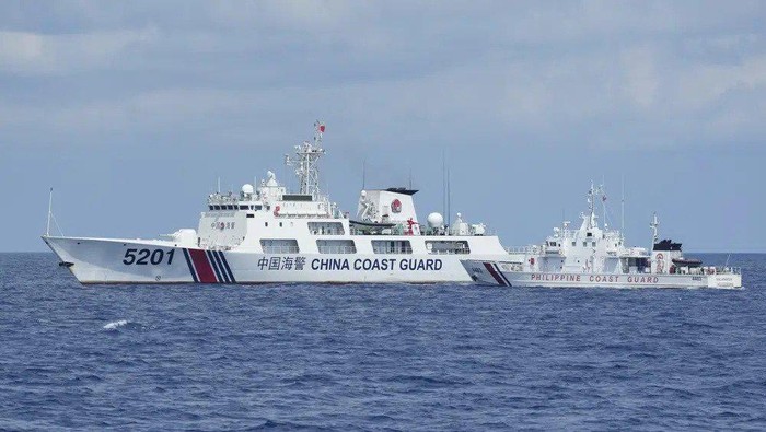 A Chinese Coast Guard ship with bow number 5201 blocks Philippine Coast Guard ship BRP Malapascua as it maneuvers to enter the mouth of the Second Thomas Shoal locally known as Ayungin Shoal at the South China Sea on Sunday, April 23, 2023. The near-collision was among the tense confrontations encountered by two Philippine government vessels against China, which undertook a weeklong voyage in one of the worlds most hotly contested sea passages to assert Philippine sovereignty. (AP Photo/Aaron Favila)