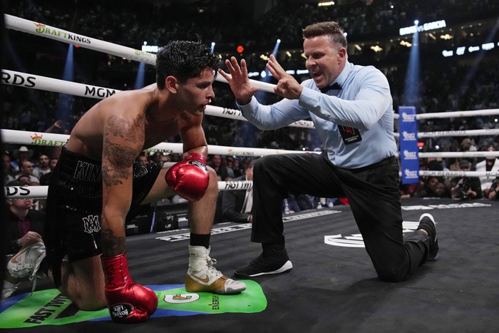 Gervonta Davis, right, swings at Ryan Garcia during a lightweight boxing bout Saturday, April 22, 2023, in Las Vegas. (AP Photo/John Locher)