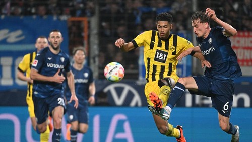 28 April 2023, North Rhine-Westphalia, Bochum: Soccer: Bundesliga, VfL Bochum - Borussia Dortmund, Matchday 30 at Vonovia Ruhrstadion, Bochums Patrick Osterhage and Dortmunds Jude Bellingham (l) in action. IMPORTANT NOTE: In accordance with the regulations of the DFL Deutsche Fußball Liga and the DFB Deutscher Fußball-Bund, it is prohibited to use or have used photographs taken in the stadium and/or of the match in the form of sequence pictures and/or video-like photo series. Photo: Federico Gambarini/dpa (Photo by Federico Gambarini/picture alliance via Getty Images)