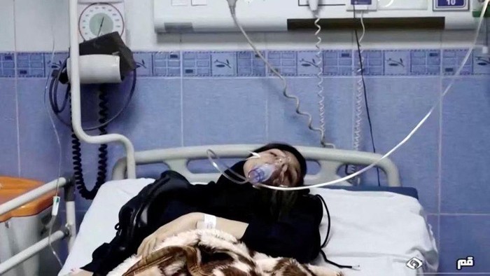 A young woman lies in hospital after reports of poisoning at an unspecified location in Iran in this still image from video from March 2, 2023. WANA/Reuters TV via REUTERS