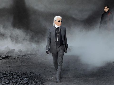 German designer Karl Lagerfeld acknowledges the public following the Chanel Autumn/Winter 2011-2012 ready-to-wear collection show on March 8, 2011 in Paris. AFP PHOTO/Patrick Kovarik (Photo by PATRICK KOVARIK / AFP)        (Photo credit should read PATRICK KOVARIK/AFP via Getty Images)