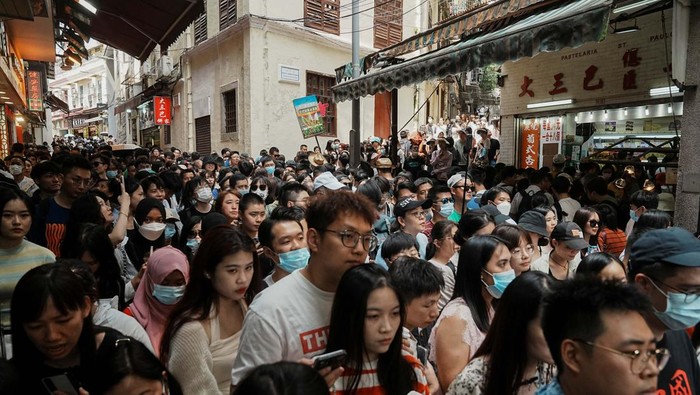 Visitors walk outside the ruins of Saint Paul's during Labour Day holiday in Macau, China, April 30, 2023. REUTERS/Lam Yik