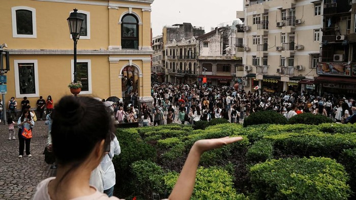 Visitors walk outside the ruins of Saint Paul's during Labour Day holiday in Macau, China, April 30, 2023. REUTERS/Lam Yik
