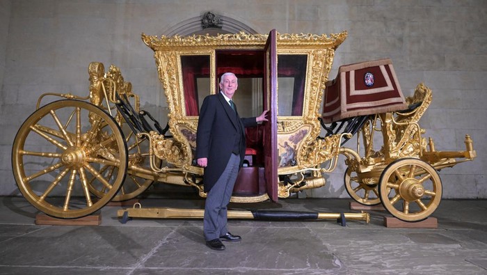 Workers transport the 17th century State Coach used by Speakers for ceremonial occasions to be on display at the Palace of Westminster to commemorate the coronation of Britain's King Charles, in London, Britain, in this undated handout photo. UK Parliament/Jessica Taylor/Handout via REUTERS THIS IMAGE HAS BEEN SUPPLIED BY A THIRD PARTY. MANDATORY CREDIT. IMAGE MUST NOT BE ALTERED.