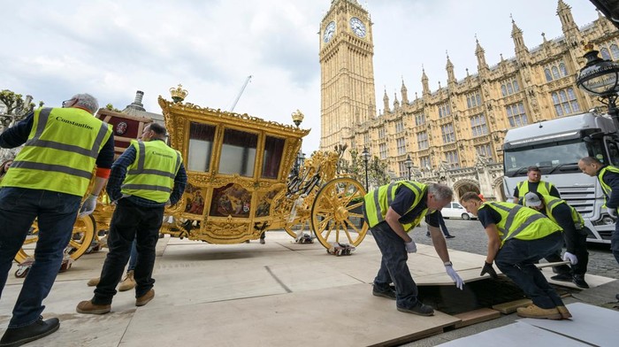 Workers transport the 17th century State Coach used by Speakers for ceremonial occasions to be on display at the Palace of Westminster to commemorate the coronation of Britain's King Charles, in London, Britain, in this undated handout photo. UK Parliament/Jessica Taylor/Handout via REUTERS THIS IMAGE HAS BEEN SUPPLIED BY A THIRD PARTY. MANDATORY CREDIT. IMAGE MUST NOT BE ALTERED.