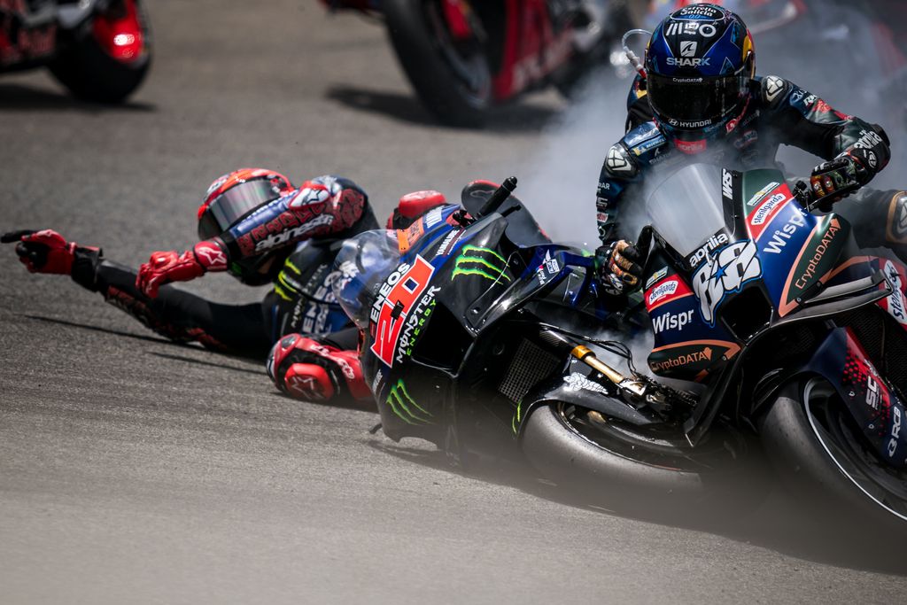 JEREZ DE LA FRONTERA, SPAIN - APRIL 30: Fabio Quartararo of France and Monster Energy Yamaha MotoGP crashes into Miguel Oliveira of Portugal and CryptoDATA RNF MotoGP Team during the race of the MotoGP Gran Premio MotoGP™ Guru by Gryfyn de España at Circuito de Jerez - Ángel Nieto on April 30, 2023 in Jerez de la Frontera, Spain. (Photo by Steve Wobser/Getty Images)