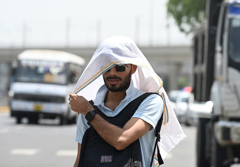 A taxi driver is seen drinking water from a bottle during afternoon heat in Kolkata , India , on 18 April 2023 . Temperature sore well above 40 Celsius as IMD has announces that heat wave will continue till the end of late on the second week of April as India experiences its highest temperature of April in nearly a decade according to report. (Photo by Debarchan Chatterjee/NurPhoto via Getty Images)