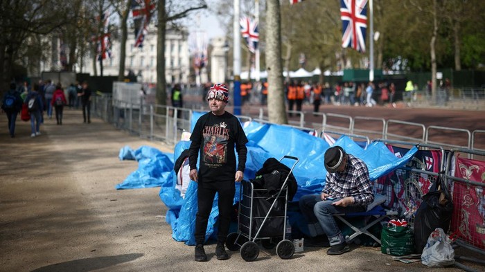 Royal fans John Loughrey and Sky London wait on The Mall outside Buckingham Palace, where they have set up camp, ahead of the Coronation of King Charles and Camilla, Queen Consort, in London, Britain, April 30, 2023. REUTERS/Henry Nicholls