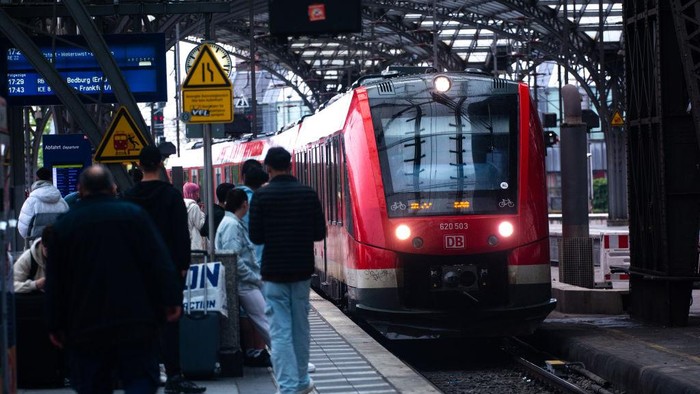 A general view of travelers is seen on the platform of Cologne Central Station during the first day of the nationwide 49 Euro ticket on May 1, 2023 (Photo by Ying Tang/NurPhoto via Getty Images).