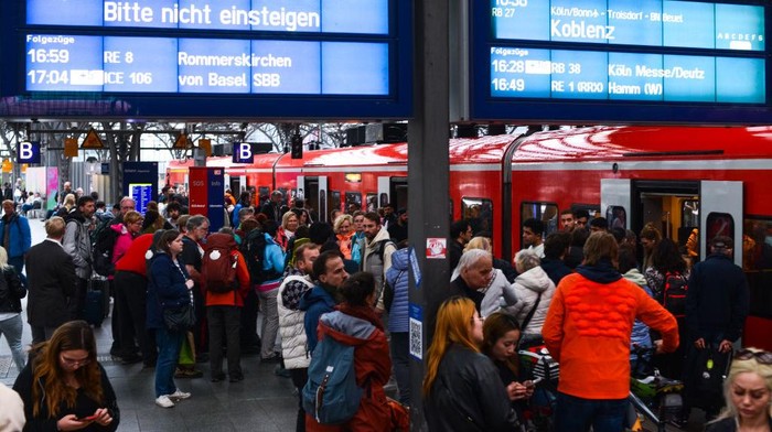 A general view of travelers is seen on the platform of Cologne Central Station during the first day of the nationwide 49 Euro ticket on May 1, 2023 (Photo by Ying Tang/NurPhoto via Getty Images).