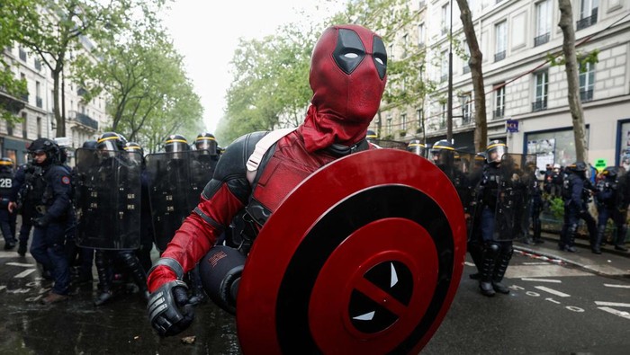 A man dressed in a costume attends the traditional May Day labour march, a day of mobilisation against the French pension reform law and for social justice, in Paris, France May 1, 2023. REUTERS/Benoit Tessier