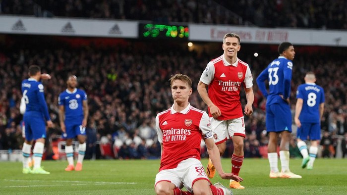 LONDON, ENGLAND - MAY 02: Martin Odegaard of Arsenal celebrates with teammates after scoring the teams second goal during the Premier League match between Arsenal FC and Chelsea FC at Emirates Stadium on May 02, 2023 in London, England. (Photo by Shaun Botterill/Getty Images)